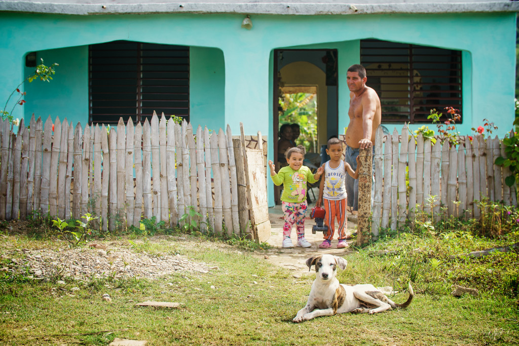 A family poses in their front yard in the countryside just out of Trinidad. Photographed on a Tamron 70-200mm f/2.8 at 1/640 and f/3.5.