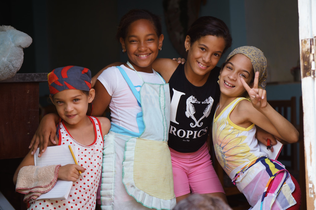 Girls pose for a photo in a home in Holguin. Photographed with a Tamron 24-70 f/2.8 at 1/250, f/2.8.